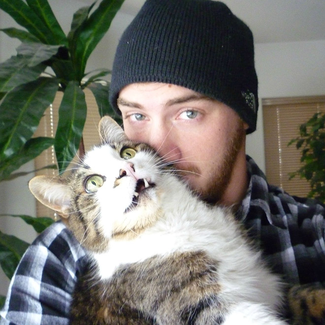 Not all cats like participating in selfies.