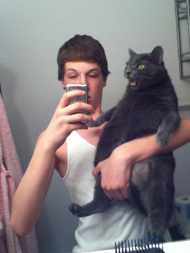 Not all cats like participating in selfies.