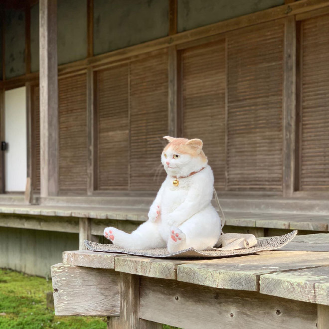 Realistic ginger cat backpack.