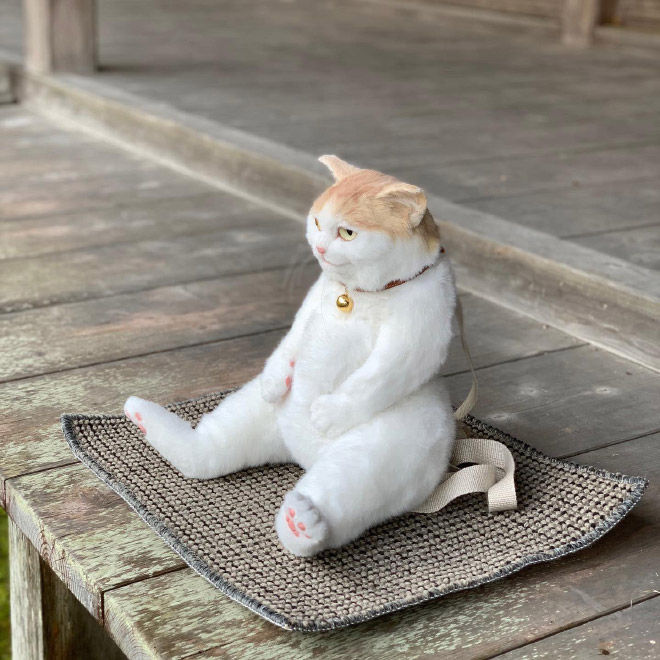 Realistic ginger cat backpack.