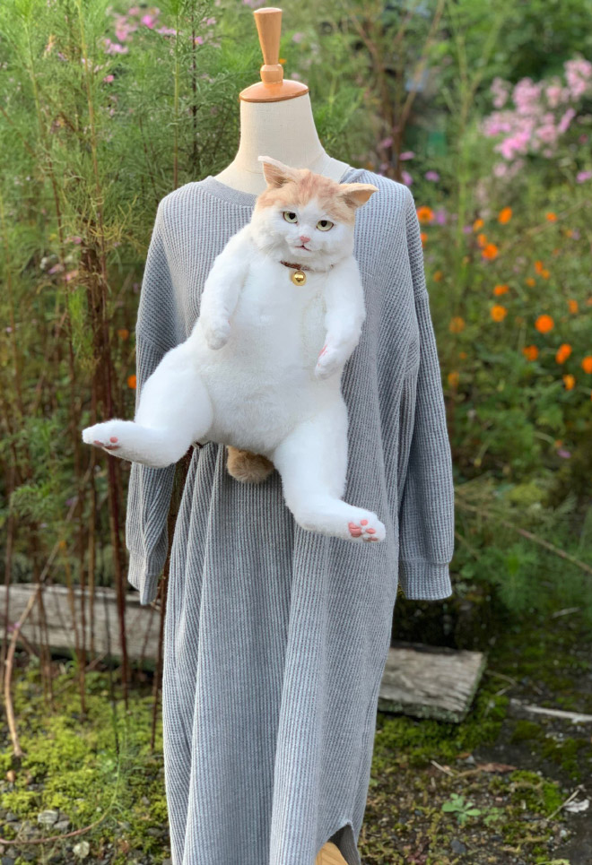 Realistic ginger cat backpack.