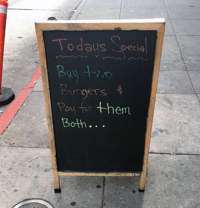 Funny restaurant sidewalk sign.