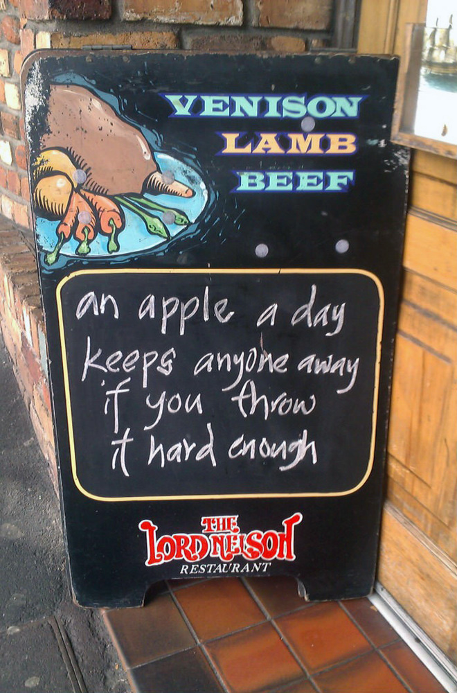 Funny restaurant sidewalk sign.