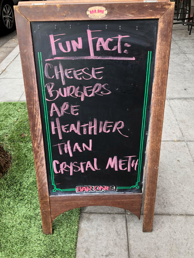 Funny restaurant sidewalk sign.