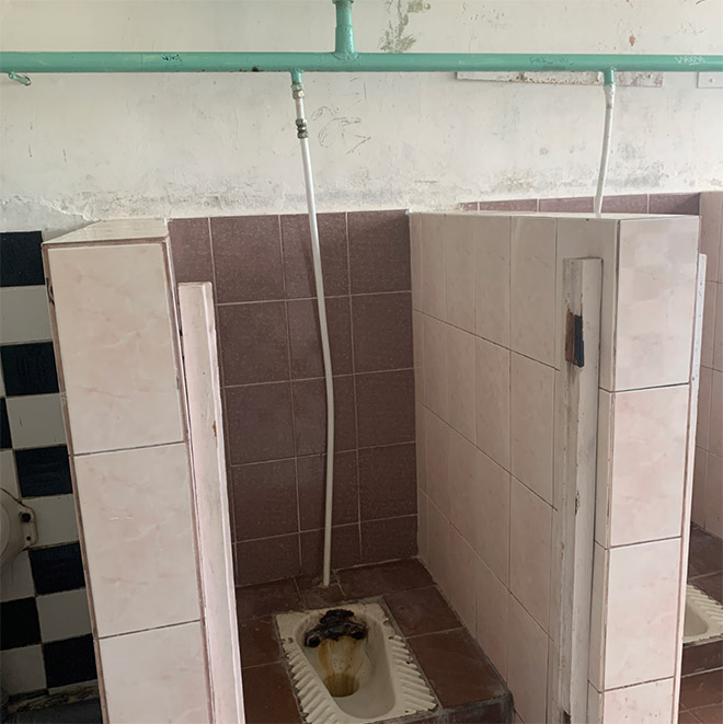 An actual toilet in a Russian school.