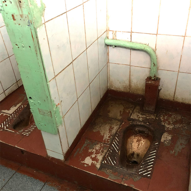 An actual toilet in a Russian school.