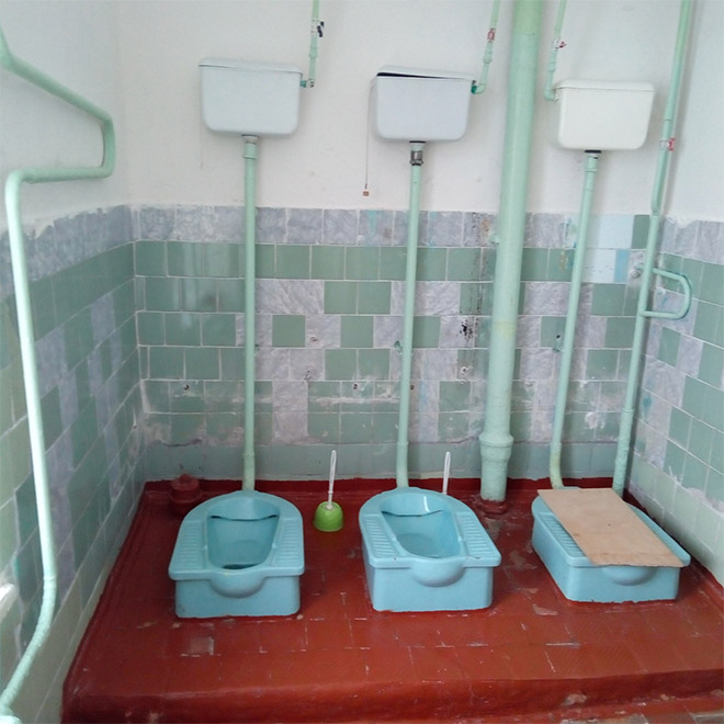 An actual toilet in a Russian school.