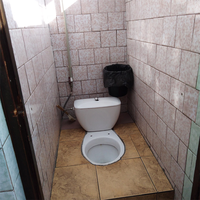 An actual toilet in a Russian school.