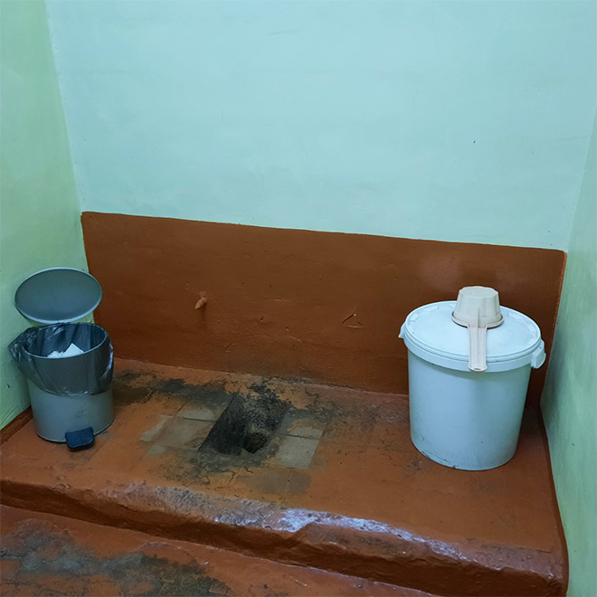 An actual toilet in a Russian school.