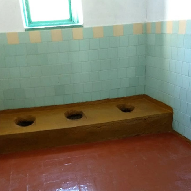 An actual toilet in a Russian school.