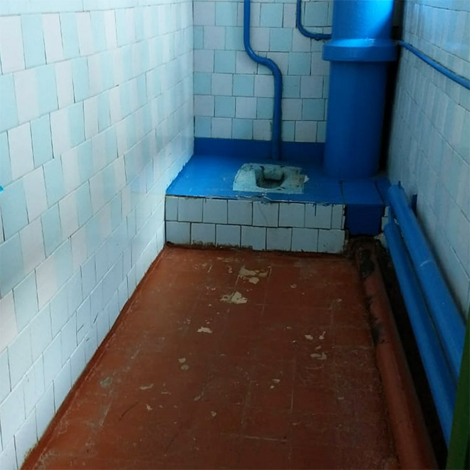 An actual toilet in a Russian school.