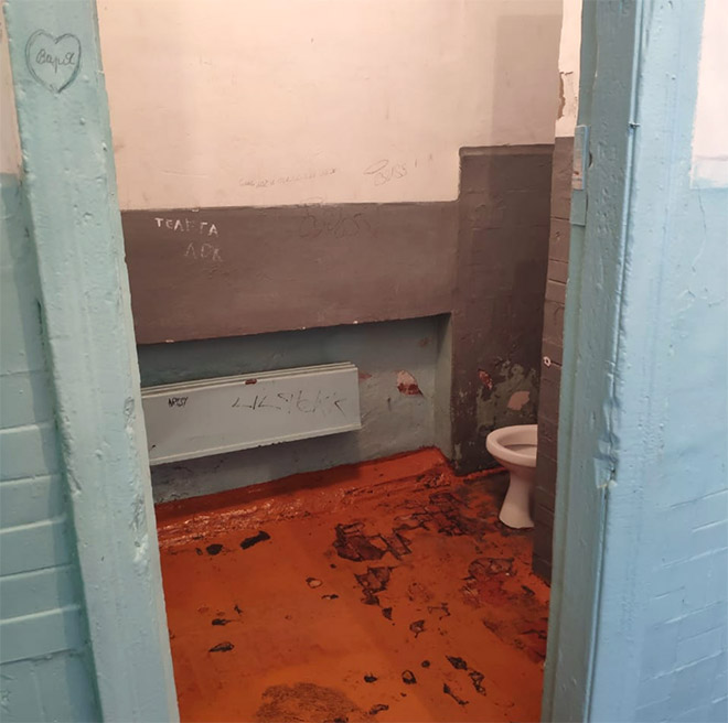 An actual toilet in a Russian school.