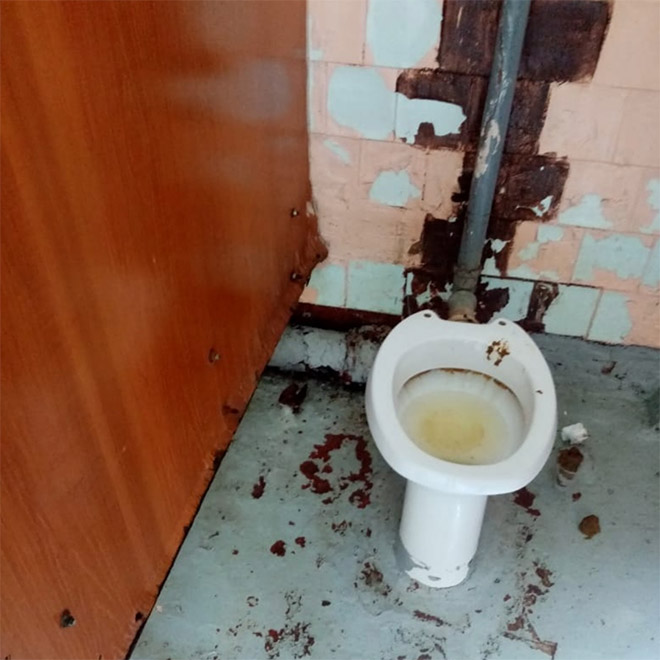 An actual toilet in a Russian school.