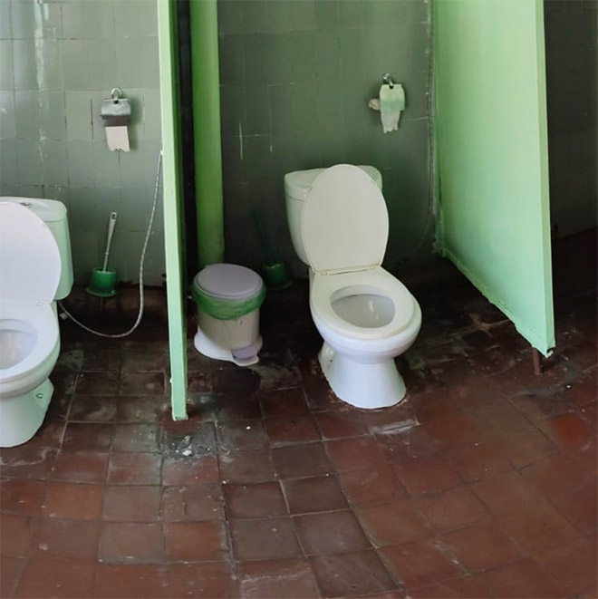 An actual toilet in a Russian school.