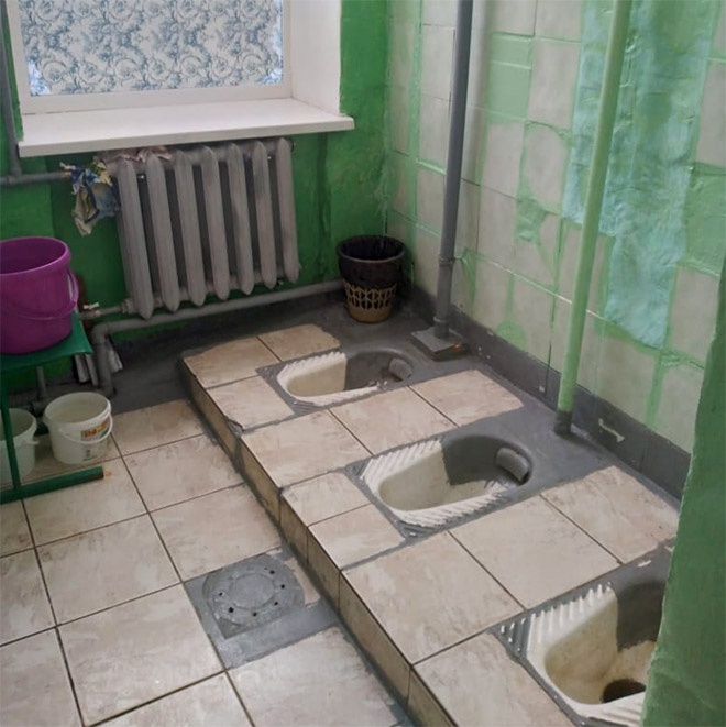 An actual toilet in a Russian school.