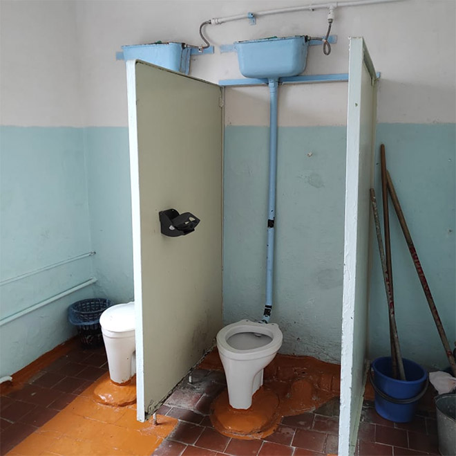 An actual toilet in a Russian school.