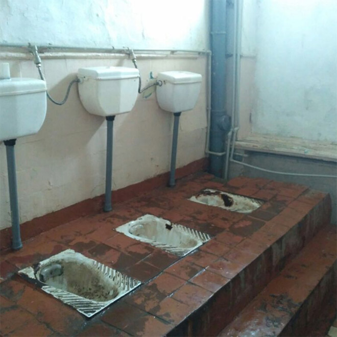 An actual toilet in a Russian school.