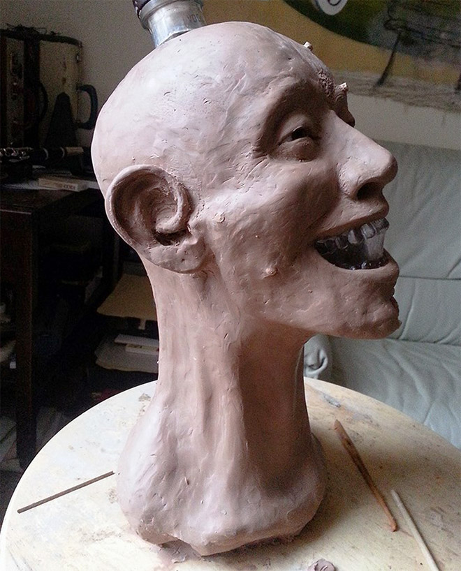 Facial reconstruction of a skull-shaped vodka bottle.
