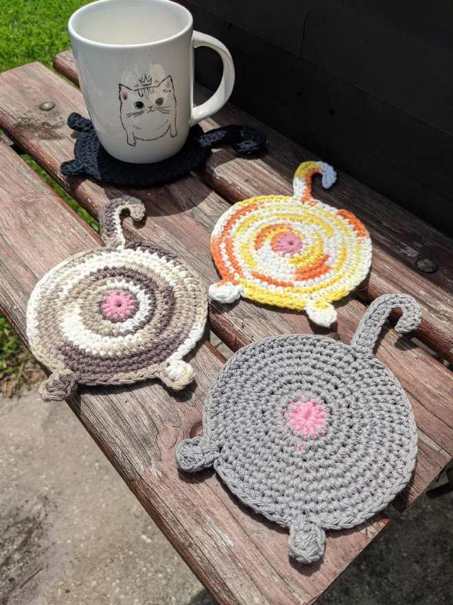 Crochet cat butt coasters.