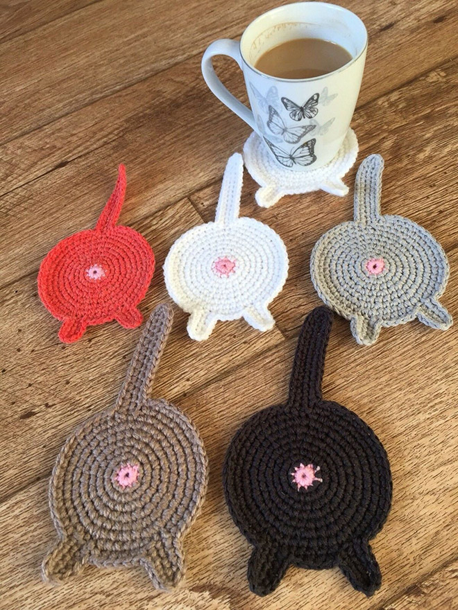 Crochet cat butt coasters.