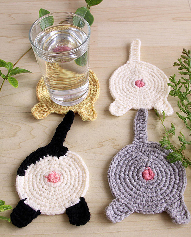 Crochet cat butt coasters.