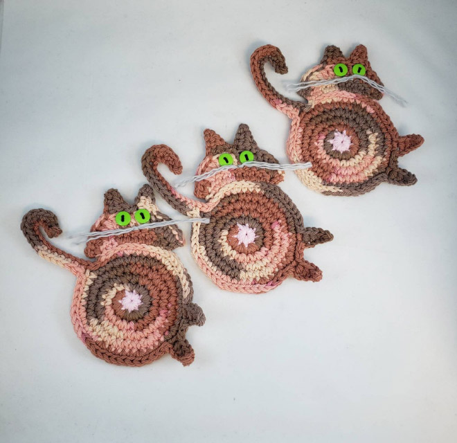 Crochet cat butt coasters.