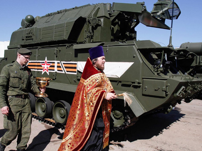 Russian priests really love blessing weapons.