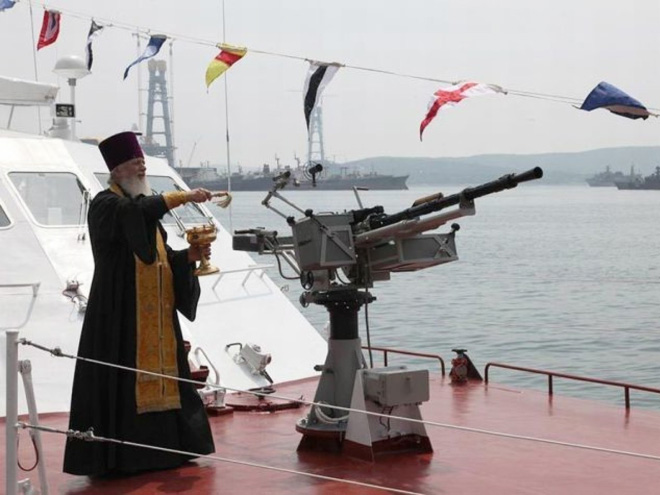 Russian priests really love blessing weapons.