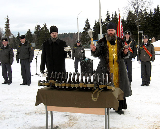 Russian priests really love blessing weapons.