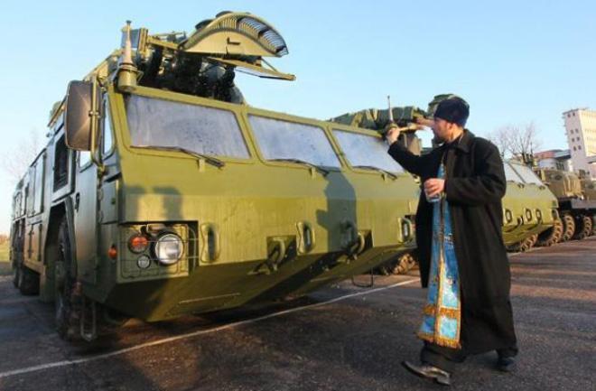 Russian priests really love blessing weapons.