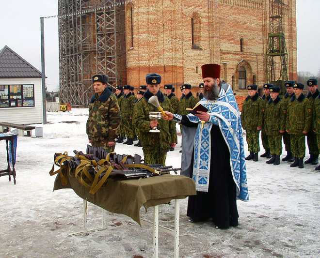 Russian priests really love blessing weapons.