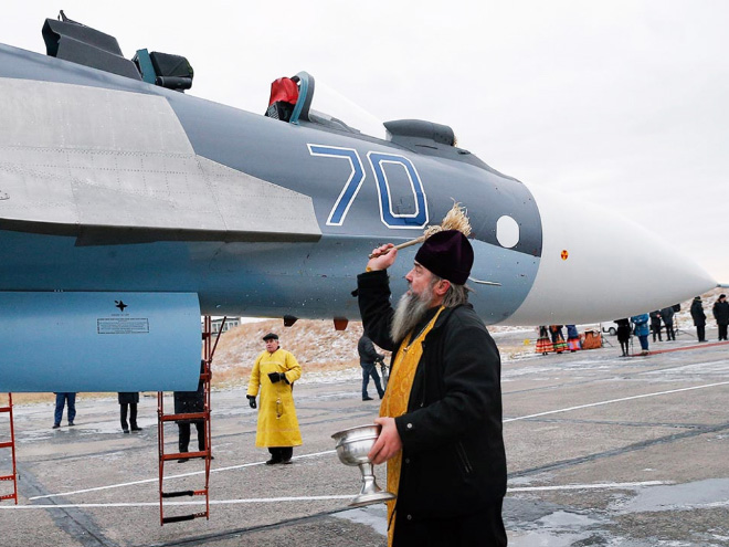 Russian priests really love blessing weapons.