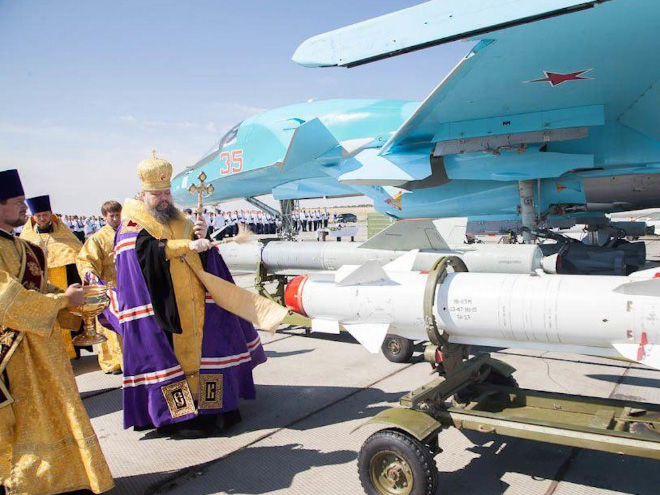 Russian priests really love blessing weapons.