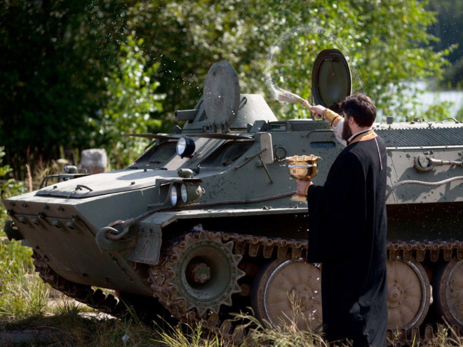 Russian priests really love blessing weapons.