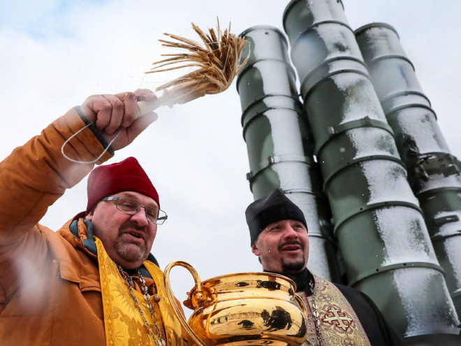 Russian priests really love blessing weapons.