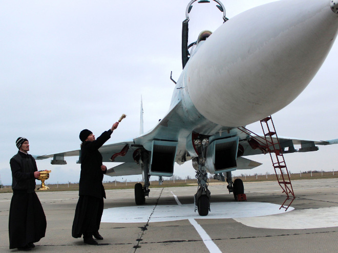 Russian priests really love blessing weapons.