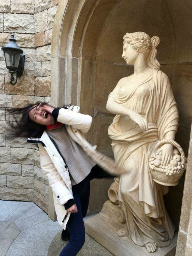 What's the point of having statues if you can't have fun with them for the sole purpose of making funny photos to share online?