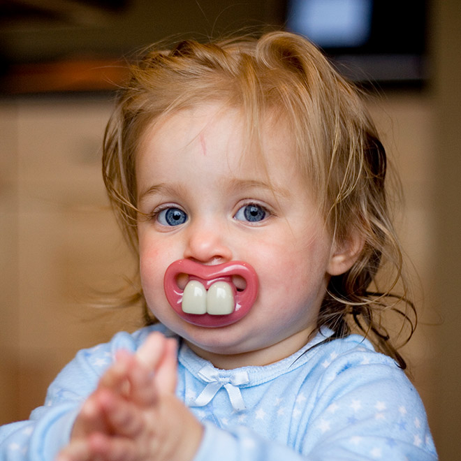 Funny teeth pacifier.