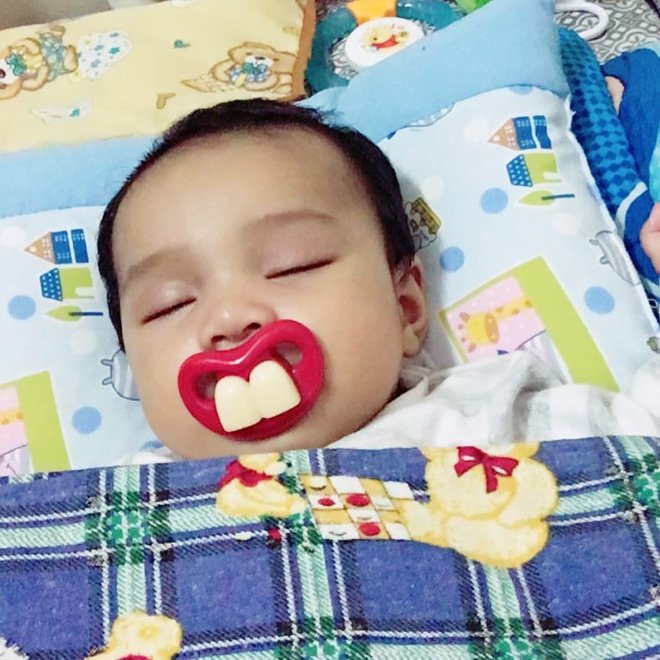 Funny teeth pacifier.